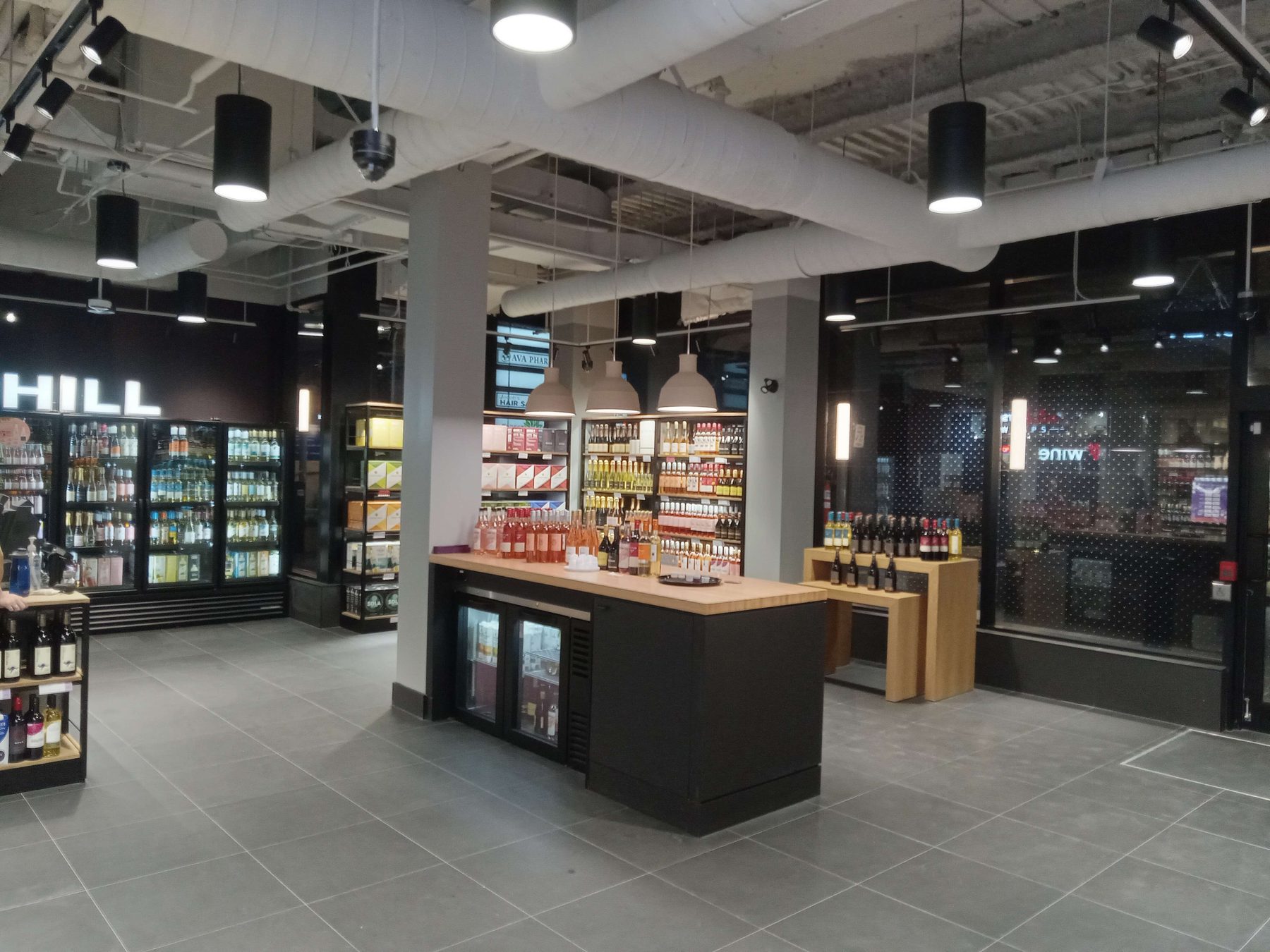 Completed Wine Rack store interior with stocked shelving and display island